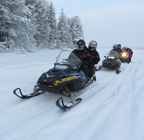 Finland snowmobile gay safari
